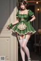 a woman in a green dress and stockings posing for a picture